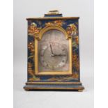 A French bracket clock with chinoiserie decoration, scrolled silvered dial and Roman numerals, on
