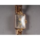 A lady's 9ct gold cased wristwatch with silvered dial and Arabic numerals, on 9ct gold expandable