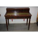 A 19th century mahogany bonheur de jour/writing desk, fitted drawers over pull-out writing surface