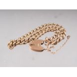 A 9ct gold curb link bracelet with heart-shaped padlock clasp, 9.4g