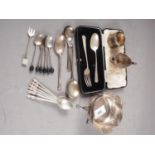 A silver sweetmeat basket, on stand, a cased christening fork and spoon, a silver napkin ring, a