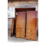 A Victorian mahogany linen press, now a wardrobe, enclosed two doors with faux drawers to base, on
