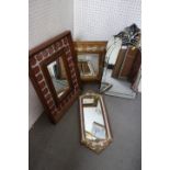 A rectangular wall mirror, 11 1/2" x 6 1/4", in a tile and hardwood frame, a triptych mirror, a gilt