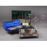 A canteen of silver plated cutlery, a two branch candelabrum, 11 1/4" high, a plated ink stand, a