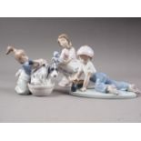 Three Lladro figures, "Bashful Bather", "Best Friend", and "All Aboard", all boxed