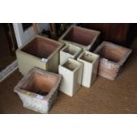 Two stoneware cube planters, three smaller similar planters and a pair of terracotta planters