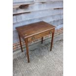 A 19th century walnut side table, fitted one drawer with oval brass handles, on square taper