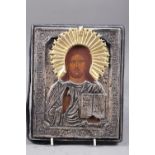 A hardwood and white metal mounted icon, 9 1/4" x 7 1/2"