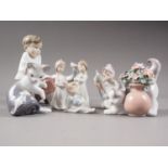 Seven Lladro figures, "Secret Spot", "Elf", "Christmas Morning" (three figures), "Cat and Mouse",