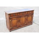 A Titchmarsh & Goodwin oak dresser base of 17th century design, fitted three drawers over three