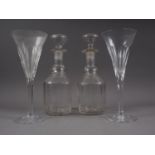 A pair of 19th century cut glass decanters and stoppers, and a pair of champagne flutes