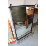 A metal framed wall mirror, 22" x 32" overall
