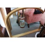 An arch top gilt framed overmantel mirror of 19th century design, 32" x 44" overall