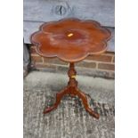 A yew octofoil wine table, on turned column and carved tripod splay support, 16" dia x 21 1/2" high