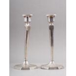 A pair of silver octagonal candlesticks, on weighted bases