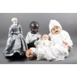 An Armand Marseille porcelain doll's head, 13 1/2, and four other dolls