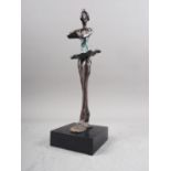 After Giacometti: a patinated figure of a dancer, 9" high, on ebonised base