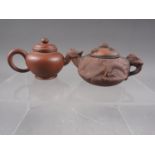 *A Chinese Yixing pottery miniature teapot with relief dragon decoration and seal mark to base, 2