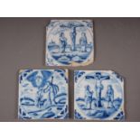 Three 18th century Dutch Delft tiles, two of the crucifixion and one of the baptism of Christ (