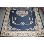 A Persian style rug of Chinese design on a blue ground,  66" x 92" approx