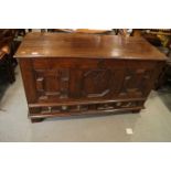 An 18th century  oak triple fielded panel front  chest, monogram WIK, on stile supports, 50" wide