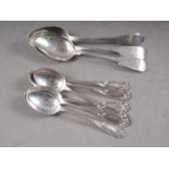 Three Georgian silver Fiddle pattern teaspoons, and a set of six silver teaspoons with scrolled