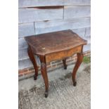 An early 19th century Italian walnut and banded serpentine front side table, fitted one drawer, on