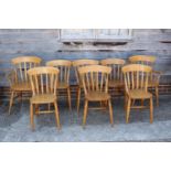 A set of eight beech lath back kitchen chairs, on turned supports (6+2)