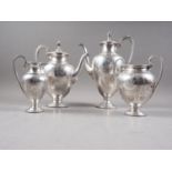 A Victorian silver four-piece tea and coffee set, comprising coffee pot, teapot, cream jug and two-