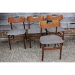 A set of four 1960s teak dining chairs with herringbone upholstery, on turned supports