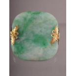 A Chinese jade and yellow metal mounted brooch, 1 5/8" wide