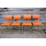 A set of four Keron chrome frame kitchen chairs, upholstered in an orange leatherette