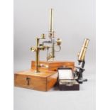 Two 19th century brass travel microscopes, in mahogany cases, a Midgard pocket microscope, in case