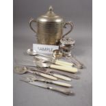 A silver plated embossed biscuit barrel and a quantity of plated flatware