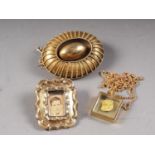 A late Victorian yellow metal brooch, a memento brooch and a golden nugget, in a pendant, on fine
