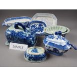 Two Willow pattern tureen bases, similar Ironstone jugs, a cheese dish, tureens and other items