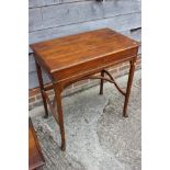 A walnut metamorphic side/writing table, the interior with tooled leather writing surface and