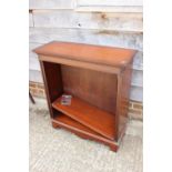 A mahogany open bookcase, fitted adjustable shelves, on bracket feet, 33" wide x 12 1/2" deep x