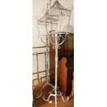 A pair of wirework candle stands, modelled as street lights, on tripod supports, 46" high