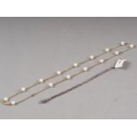 A 9ct gold and cultured pearl necklace and a silver rattail bracelet