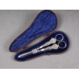 A pair of silver plated grape scissors, in fitted case