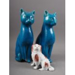A 19th century model spaniel, 4" high, and a pair of turquoise glazed cats (one damaged), 10" high