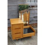 A 1950s light oak dressing table, fitted three drawers and full length mirror, 34" wide x 18" deep x