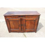 A 19th century French carved fruitwood sideboard, fitted two drawers over cupboards, enclosed