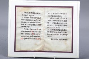 A fragment of a Medieval missal on velum, in double sided glass mount, and a print of a sailing