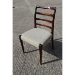 A set of eight D-Scan 1960s teak ladder back dining chairs with stuffed over seats, on turned and