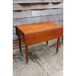 A late 19th century mahogany Pembroke table, fitted one drawer, on turned and castored supports, 36"