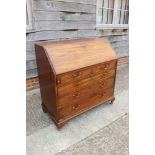 A Georgian mahogany fall front bureau, the interior fitted drawers and pigeonholes over two short