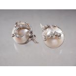 A pair of white metal diamond and half pearl ear clips, total weight 16.4g