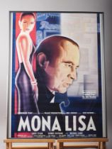 A colour film poster, "Mona Lisa", in strip frame, a Haagen Das advert poster, in gilt strip